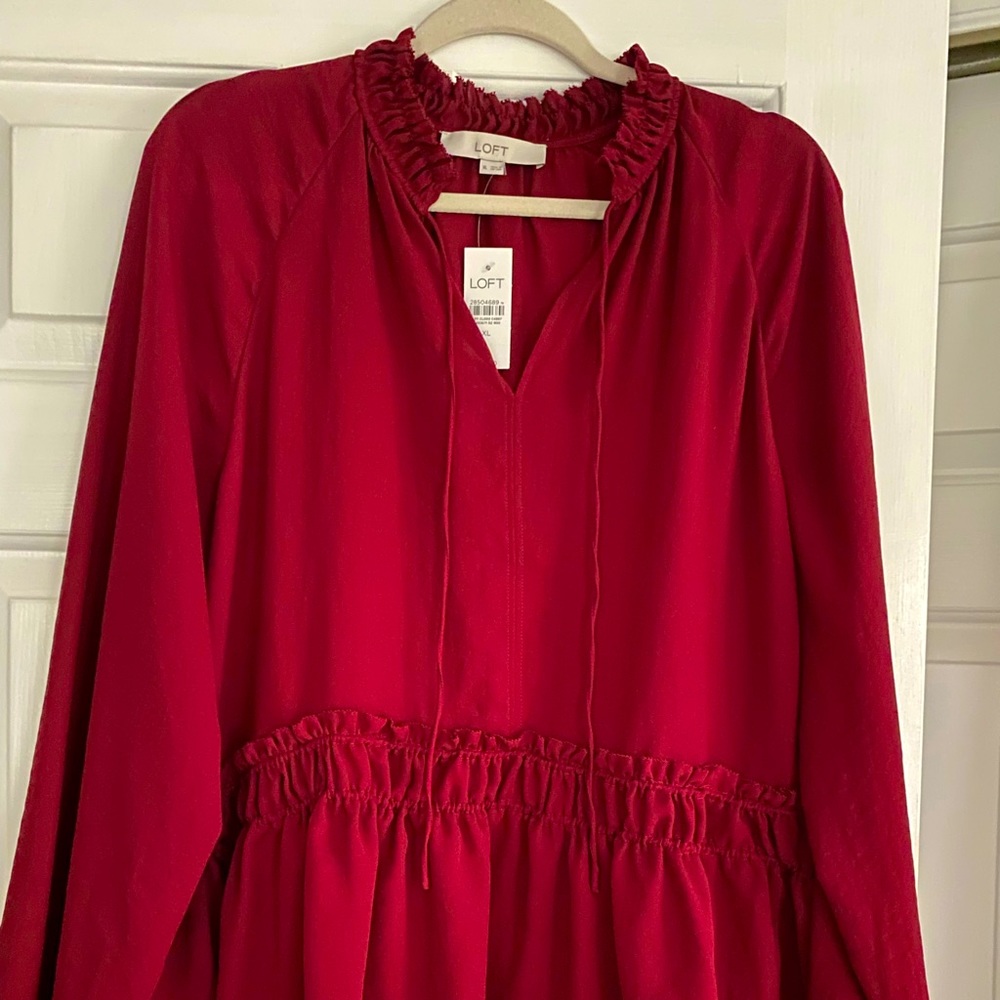 New with tags Loft peplum blouse. Beautiful rich color.
